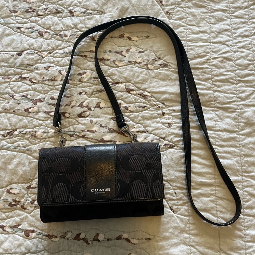 Lovingly used, small Coach phone purse.